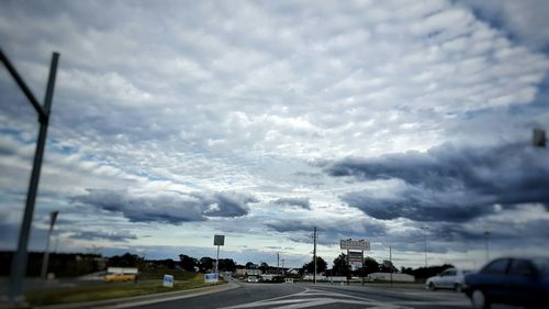 View of road against cloudy sky