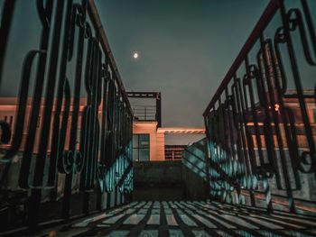 Staircase of building against sky at night