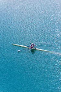 High angle view of athlete rowing on sea