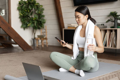 Young woman using mobile phone