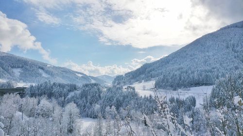 Scenic view of mountains against sky during winter