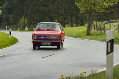 Car on road against trees