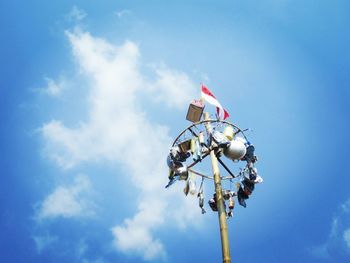 Low angle view of flag against blue sky