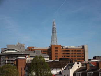 Low angle view of buildings in city against sky