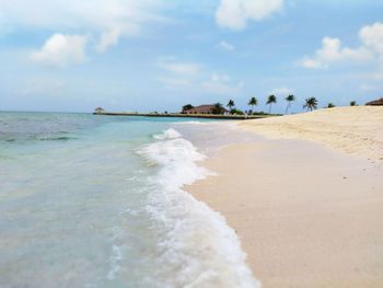 Scenic view of beach against sky