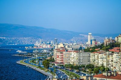 View of cityscape against clear blue sky