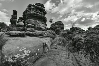 Low angle view of brimham rocks by against sky