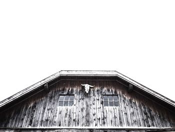 Low angle view of barn against clear sky