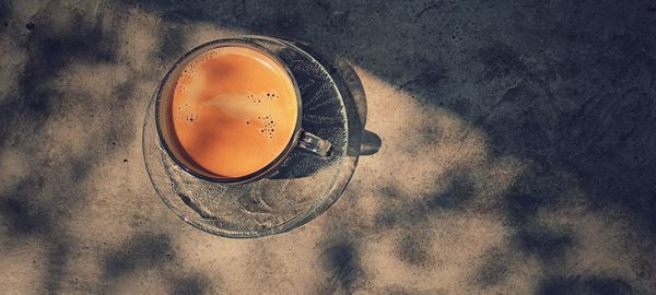 High angle view of coffee cup on table