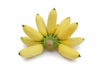 Close-up of bananas against white background