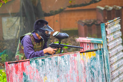 Side view of man working in workshop