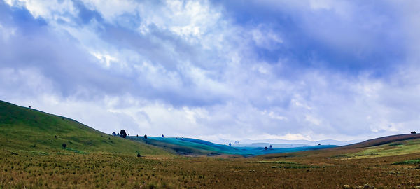 Panoramic view of field against sky