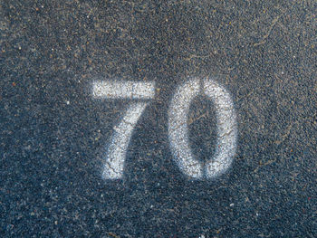 High angle view of number 70 on road