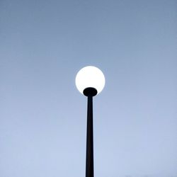 Low angle view of street light against clear sky