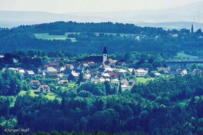 Scenic view of town against sky