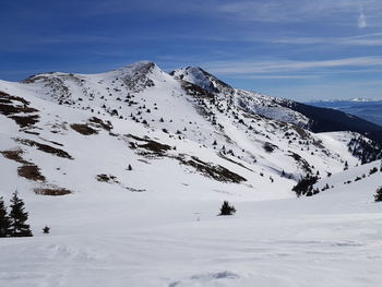 Scenic view of snowcapped mountains against sky