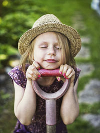 Smiling girl wearing straw hat