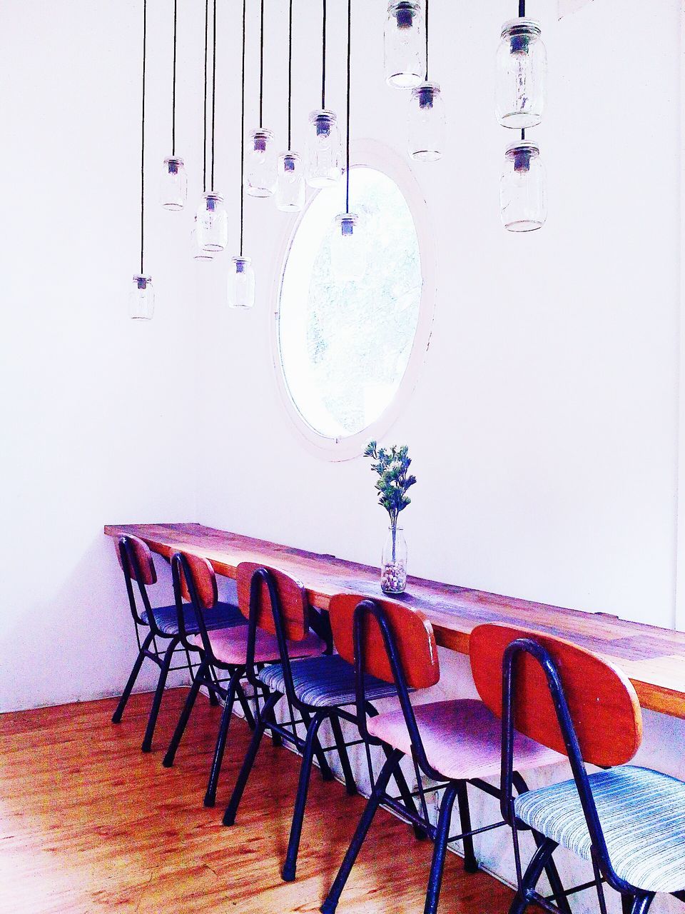 chair, empty, absence, hanging, wall - building feature, table, indoors, large group of objects, in a row, still life, no people, arrangement, seat, built structure, day, wood - material, metal, group of objects, wall, red