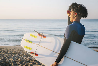 Side view of man standing on beach