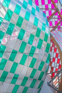 Low angle view of ferris wheel against sky