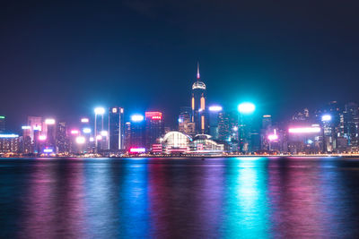 Illuminated buildings in city at night