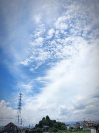 Low angle view of smoke stack against sky