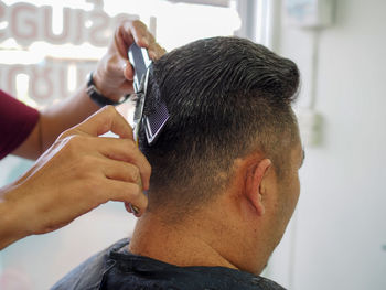 Hairdresser hairstyling male customer