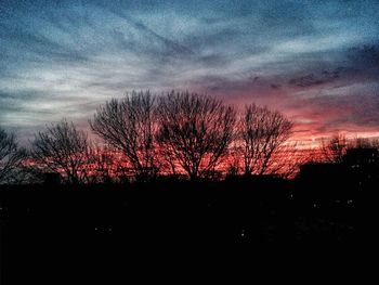 Scenic view of landscape against sky at sunset