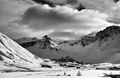 Scenic view of snow mountains against sky