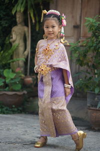 Portrait of girl standing outdoors