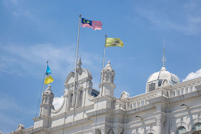 Low angle view of building against blue sky