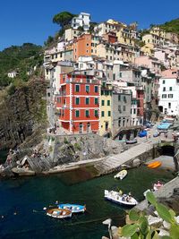 High angle view of buildings by sea