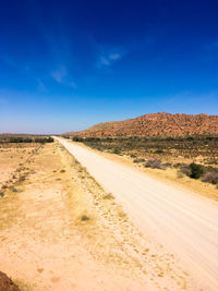 Dirt road passing through a desert