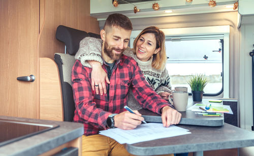 Cheerful couple in motor home