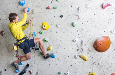 High angle view of boy playing on table