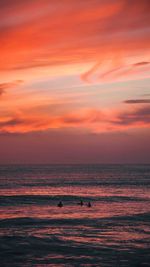 Scenic view of sea against romantic sky at sunset