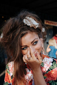 Close-up of smiling young woman looking away in city