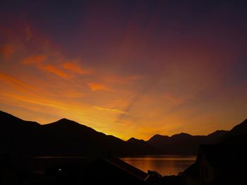 Scenic view of silhouette mountains against sky during sunset