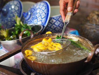 Midsection of person preparing food