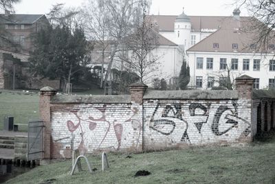 Graffiti on house in city