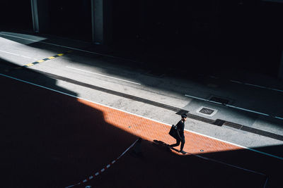 Woman walking on road