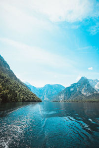 Scenic view of lake and mountains against sky