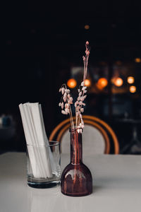 Close-up of flowers in bottle on table