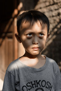 Close-up portrait of boy looking away