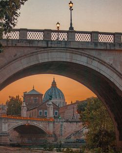 Arch bridge over river in city