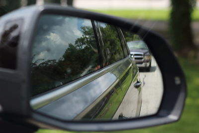 Reflection of car on side-view mirror