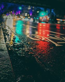Close-up of illuminated city street at night