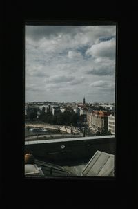 City seen through glass window