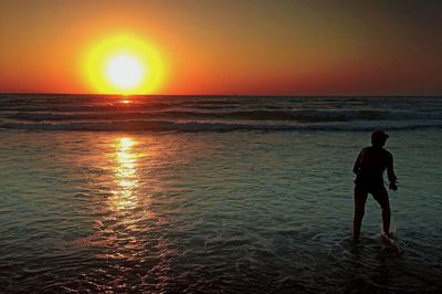 Scenic view of sea at sunset