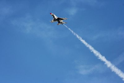 Low angle view of kite flying in sky